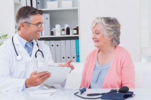 doctor speaking with elderly patient: CannaLinq Cannabis Blog